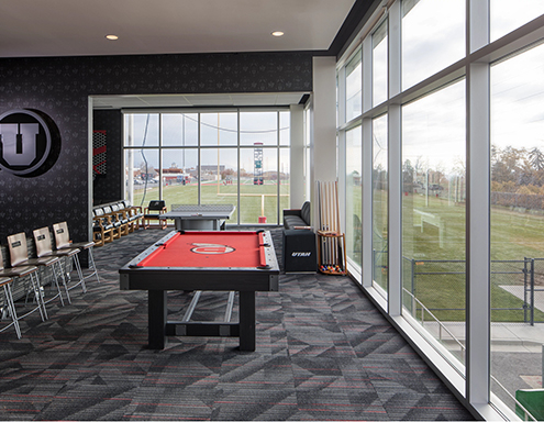flooring with pool table and windows